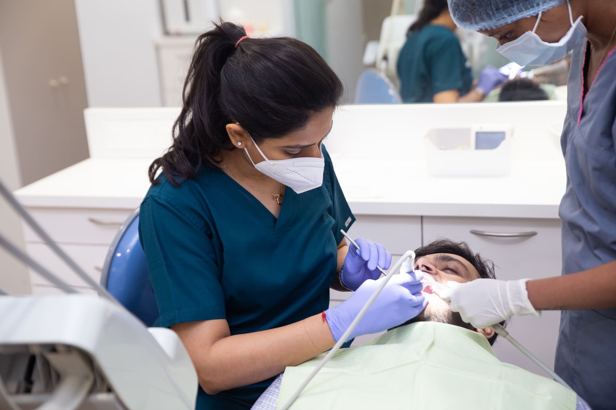 Dr. Upasana Gosalia treating a patient at i-Smile Dental Clinic
